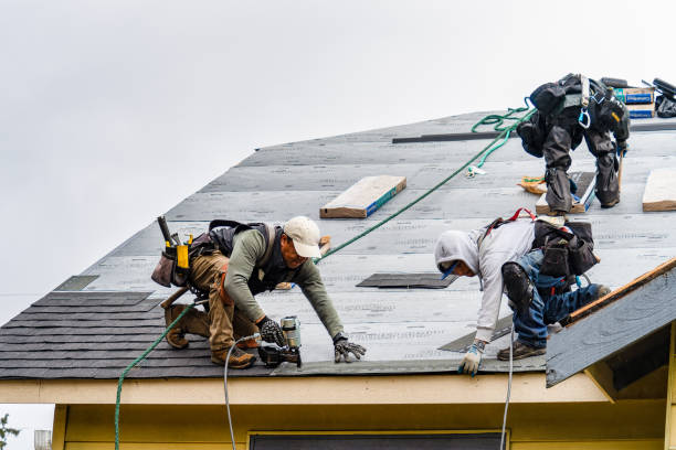 Professional Roofing technician working in Montchanin, DE